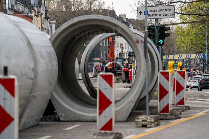 Concrete sewer pipes, stored on a construction site during sewer renovation work, on the Dickswall, city centre of Mülheim an der Ruhr, North Rhine-Westphalia, Germany, Europe