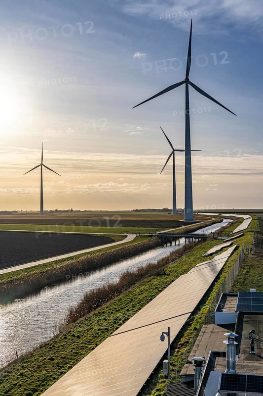 Solar park on the Slaperdijk dyke near the Eemshaven, test project, 17, 000 solar modules were installed over a good 5 kilometres, the Netherlands has over 22, 000 kilometres of dyke line, here it is being tested whether such an installation is successful and can be expanded, wind farm, Groningen, Netherlands