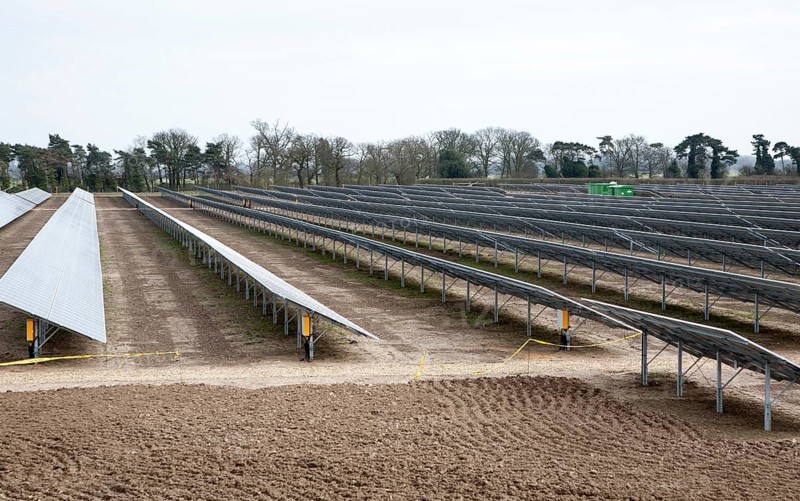 Solar array of photovoltaic panels in a large new solar park at Bucklesham, Suffolk, England, United Kingdom, Europe