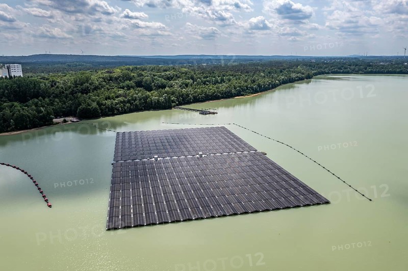Germany's largest floating solar power plant on the Silbersee III, a quarry pond no longer used for sand mining, near Haltern am See, operated by Quarzwerke GmbH, around 5800 solar modules, on an area of a good 2 football pitches, generate 3.1 megawatts of power, the company uses the electricity itself on weekdays, at weekends it flows into the public grid, North Rhine-Westphalia, Germany, Europe
