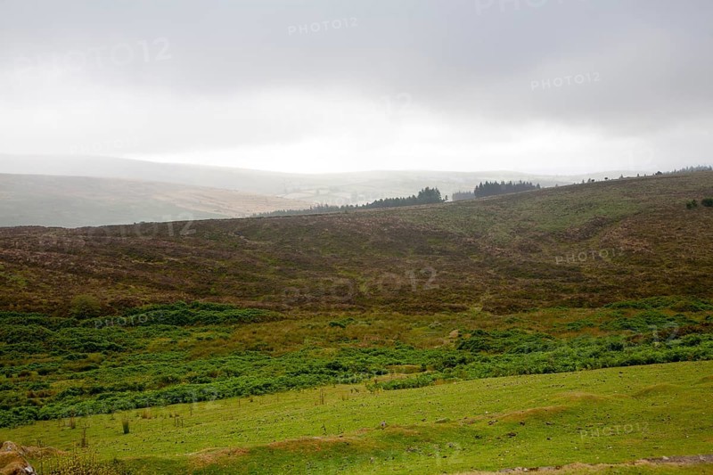 Grey overcast weather clouds hanging over moorland, Dartmoor national park, near Postbridge, Devon, England, UK