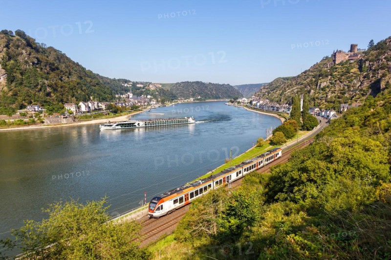 Stadler Flirt train regional railway Regional train of VIAS with river Rhine, castle Katz at the Lereley in St. Goarshausen, Germany, Europe