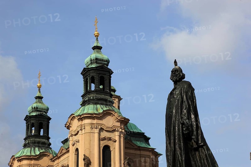 Jan Hus Monument on Old Town Square and the baroque St Nicholas Church, Prague, Czech Republic, Europe