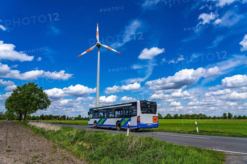 Wind turbine, wind energy plant from the manufacturer Enercon, blue sky with many white clouds, near Schermbeck, country road, Bestener Straße, North Rhine-Westphalia, Germany, Europe