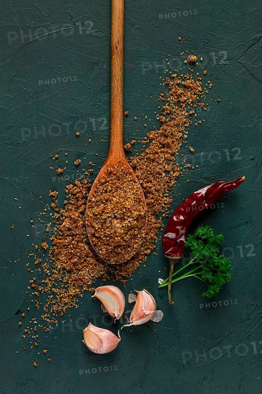 Svan salt, wooden spoon, garlic, red hot pepper, herbs and spices, Georgian cuisine