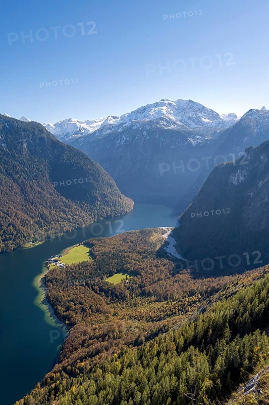 View of the Königssee with St. Bartholomä church, from the Rinnkendlsteig mountain hiking trail, autumn forest and snow-covered mountains, Berchtesgaden National Park, Berchtesgadener Land, Upper Bavaria, Bavaria, Germany, Europe