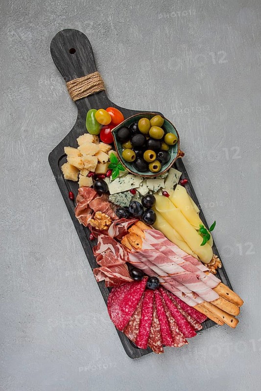 Appetizer, assortment, set, sausage, and cheese, on a wooden board, top view, no people