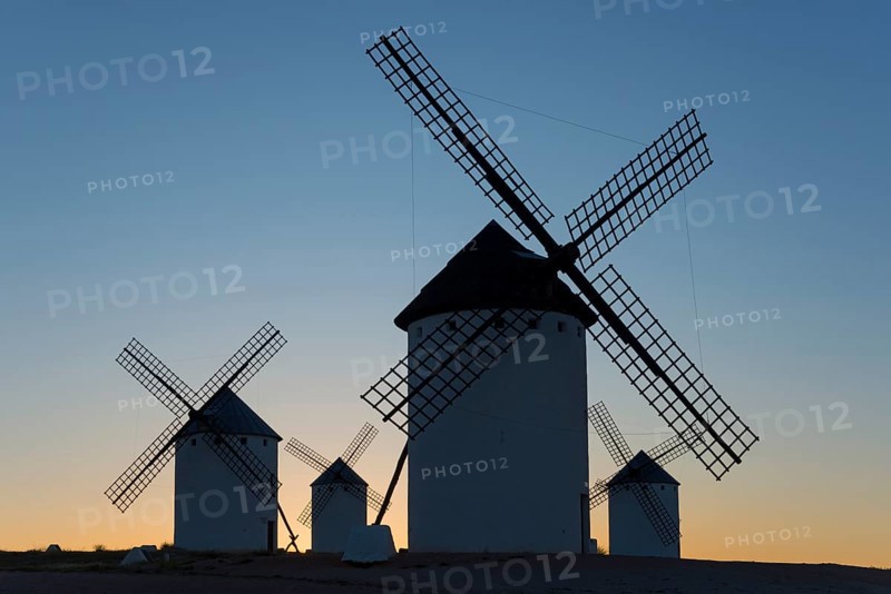 Silhouettes of windmills against a clear sky at sunset, windmills, Campo de Criptana, Ciudad Real province, Castilla-La Mancha, Route of Don Quixote, Spain, Europe