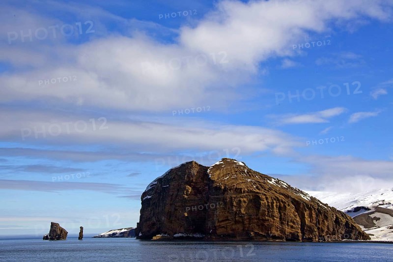 In front of the entrance to the narrow inlet into the water-filled crater of Deception Island Antarctica, rock, island, Antarctica