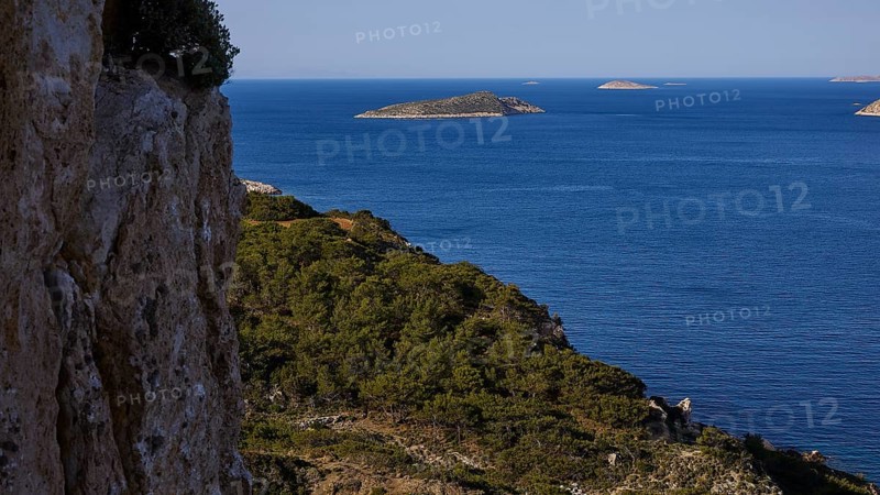 View of the sea with distant islands and a rocky, overgrown coast, Makri Island, Alimia Island, Chalki Island, Kritinia Castle, St John's Castle, Kritinia, Rhodes, Dodecanese, Greek Islands, Greece, Europe