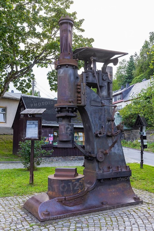 Situated on the Sehma, the Frohnau hammer became Saxony's first technical monument in 1907 and is Germany's oldest blacksmith museum. In addition to the hammer mill and the manor house, the museum complex includes an exhibition on forged products, a free-form hammer, a mechanical Heimatberg as well as a lace-making parlour and restaurant in the manor house. The monument is part of the Erzgebirge/Krušnohorí Mining Region, which has been a UNESCO World Heritage Site since 2019. A free-form hammer is set up on the open-air site. These steam hammers replaced the water-powered hammers from 1860, Frohnauer Hammer, Annaberg Buchholz, Saxony, Germany, Europe