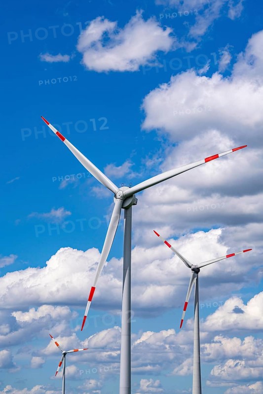 Wind turbine, wind energy plant from the manufacturer Enercon, blue sky with many white clouds, near Schermbeck, North Rhine-Westphalia, Germany, Europe
