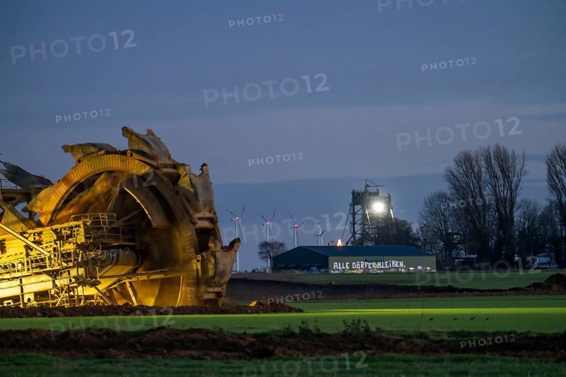 Two excavators are working around the hamlet of Lützerath, occupied by climate activists, the remains of the village are to make way for lignite mining, an eviction is imminent, North Rhine-Westphalia, Germany, Europe
