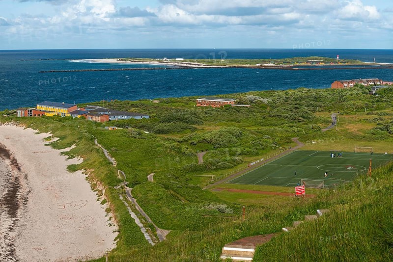 View from Oberland to Nord-Ost-Land in Unterland with youth hostel, house of youth in Unterland at Nordstrand, football pitch, recreation park, guest house of the Alfred Wegener Institute (centre), offshore island Helgoland, Helgoländer Düne, North Sea, Pinneberg district, Schleswig-Holstein, Germany, Europe