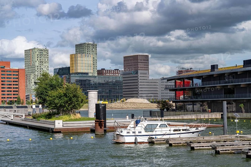 The Floating Office Rotterdam, is considered the world's largest floating office building, first part of the floating park, in the Rijnhaven, 28ha harbour basin, has now been filled in by almost a third to create space for up to 3000 flats, there will be an artificial beach, a floating park connected by jetties, restaurants and shops, cultural facilities, a major urban development project in the old harbour, the Rijnhaven is adjacent to the popular districts of Kop van Zuid and Katendrecht, Rotterdam, Netherlands
