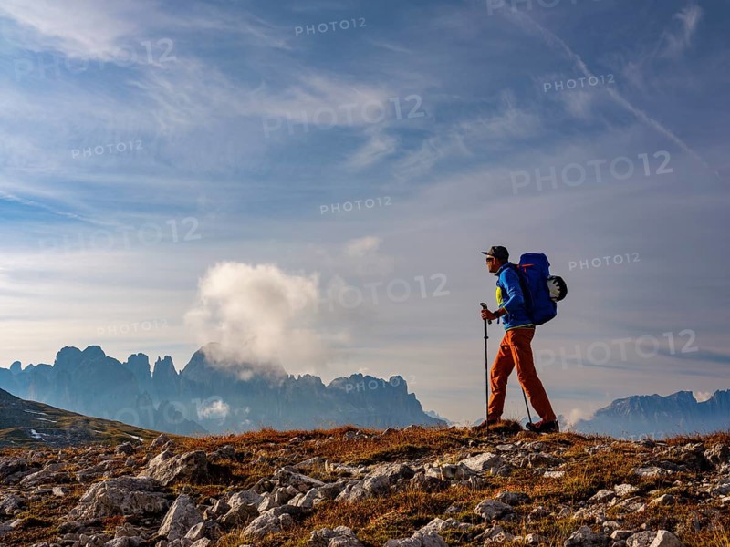 Mountaineer with view of rose garden, Schlern, Dolomites, South Tyrol, Italy, Europe
