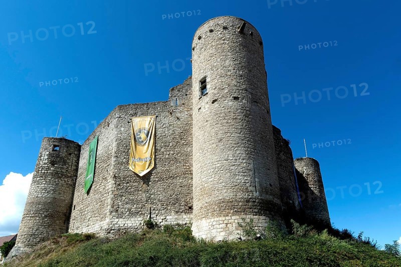 Billy. The fortress castle of the XIII Century, and its coloures banners of the houses of Hogwarts College (Harry Potter), Allier. Auvergne-Rhone-Alpes.France