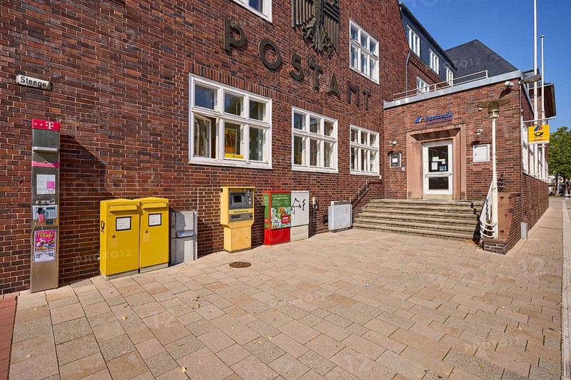Entrance to the post office with public telephone, letterboxes and stamp vending machine in Bad Salzuflen, Lippe district, North Rhine-Westphalia, Germany, Europe