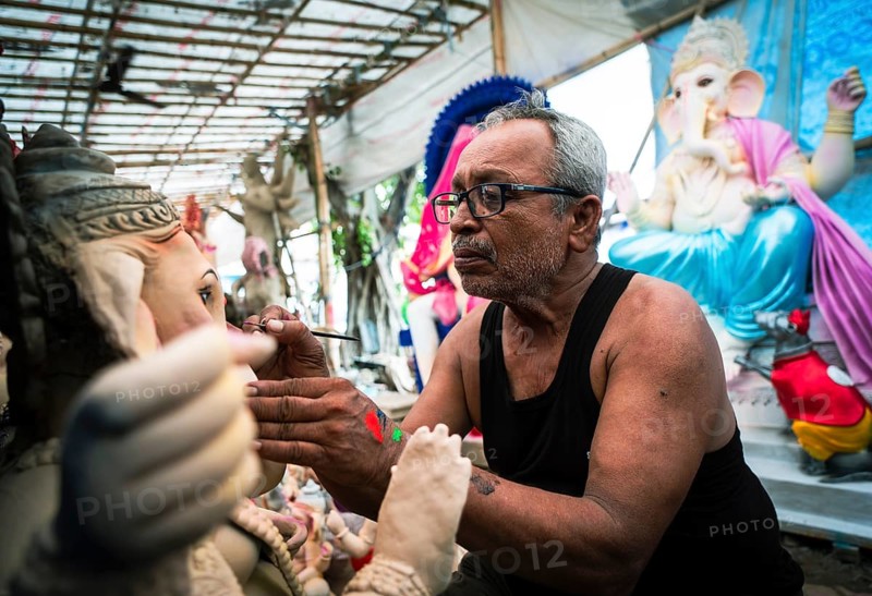 An artisan gives final touches to an idol of the elephant-headed Hindu deity Ganesha at a workshop ahead of the Ganesh Chaturthi festival on September 5, 2024 in Guwahati, Assam, India, Asia