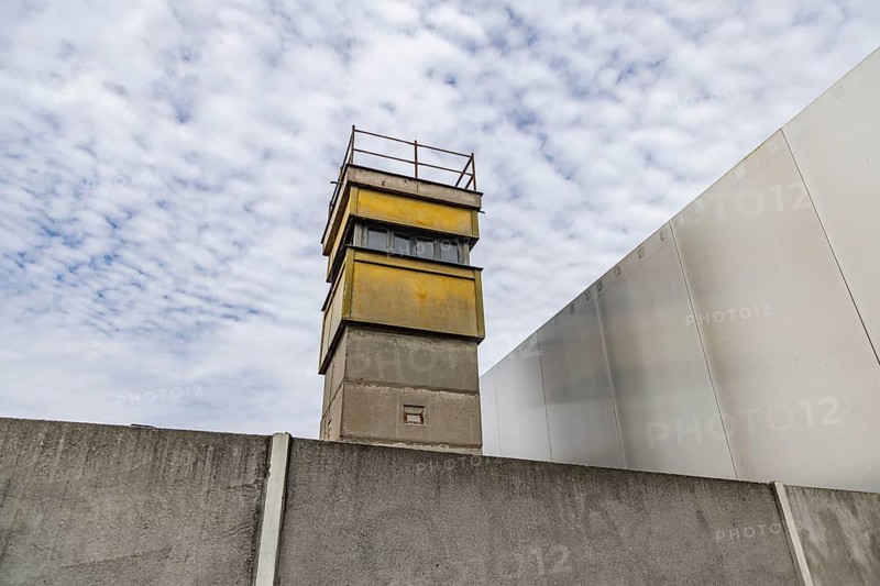 Berlin Wall Memorial, sight and reminder of the division by the Berlin Wall and of the fatalities at the border. Original preserved border strip with watchtower on Bernauer Strasse, Berlin, Germany, Europe