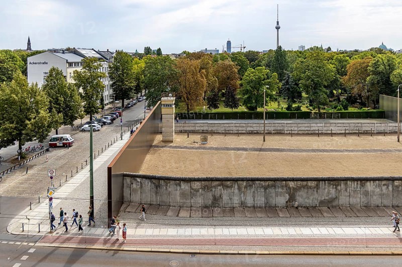 Berlin Wall Memorial, sight and reminder of the division by the Berlin Wall and of the fatalities at the border. Original preserved border strip with watchtower on Bernauer Strasse, Berlin, Germany, Europe