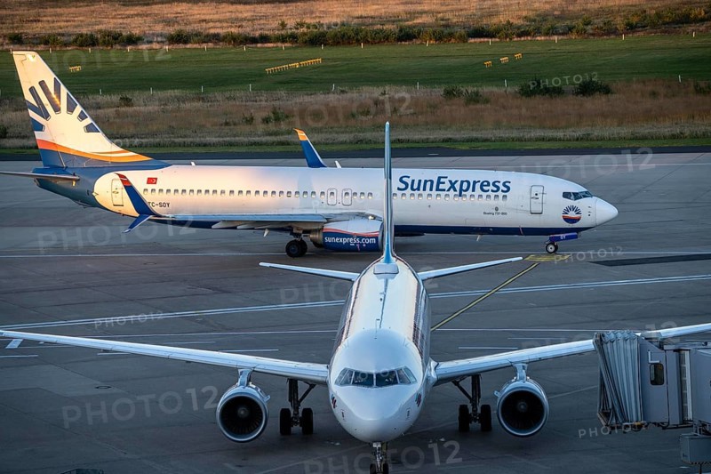 Eurowings Airbus at Terminal 1, C-Gates, Sunexpress Boeing 737 taxiing to the runway, Cologne-Bonn Airport, CGN, North Rhine-Westphalia, Germany, Europe