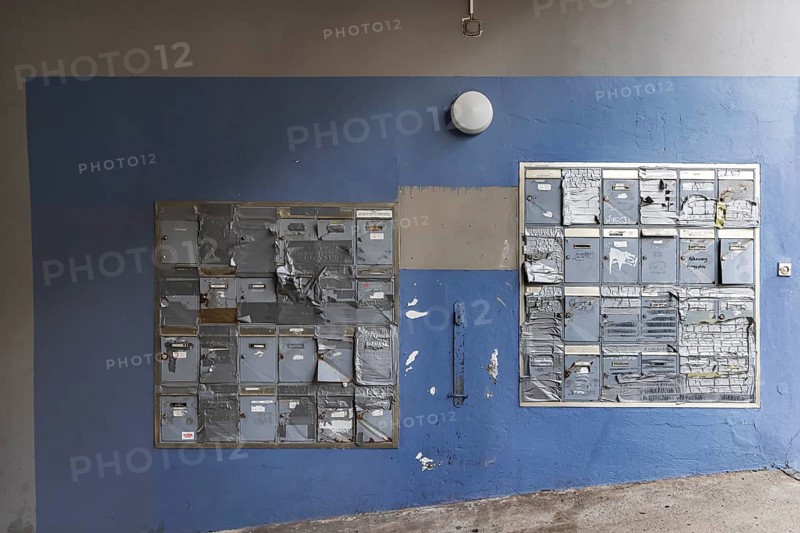 Doorbell sign, broken letterbox system on a dilapidated block of flats in Stuttgart, Baden-Württemberg, Germany, Europe