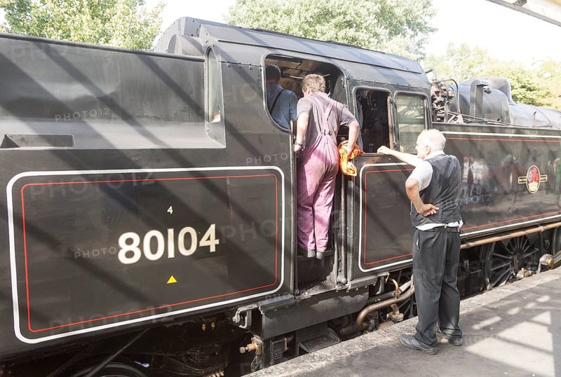 BR Standard Class 4 80104 steam locomotive train engine at platform of railway station, Swanage, Dorset, England, UK