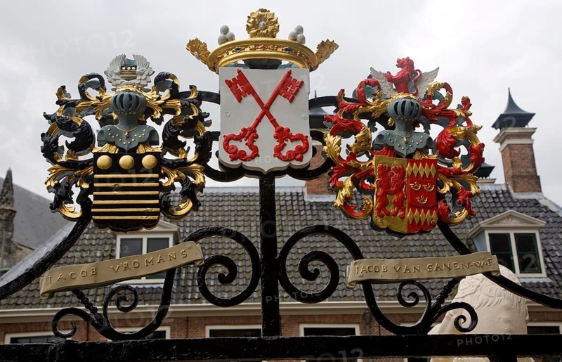 Ancient family coat of arms on railings at De Burcht historic site, Leiden, Netherlands with red crossed keys the coat or arms for Leiden