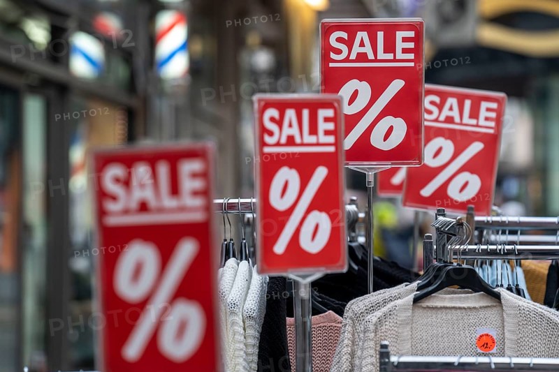 Sale, special offers of a clothing shop in the pedestrian zone, in Duisburg, North Rhine-Westphalia, Germany, Europe