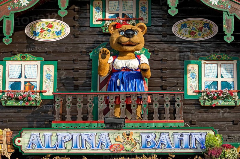 Mountain hut with teddy bear in traditional traditional costume, bear figurine, decoration of the roller coaster Alpinabahn at the Wies'n, Oktoberfest, Wiesn, Munich, Upper Bavaria, Bavaria, Germany, Europe