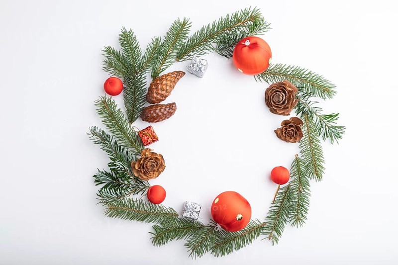 Christmas or New Year wreath composition. Decorations, balls, cones, fir and spruce branches, on white background. Top view, copy space, flat lay
