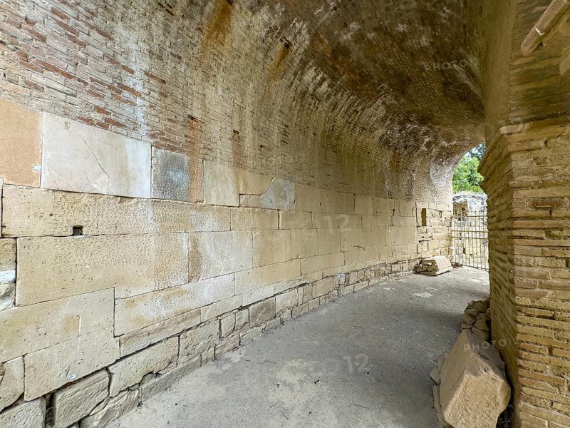 View of sandstone blocks Stones made of sandstone with written chiselled laws carved into the wall of the archway behind the amphitheatre City law of Gortys carved in stone Gortyn law book Large inscription, written in Doric dialect alternately from left to right and right to left, oldest discovered legal text in Europe, Gortyna, Crete, Greece, Europe