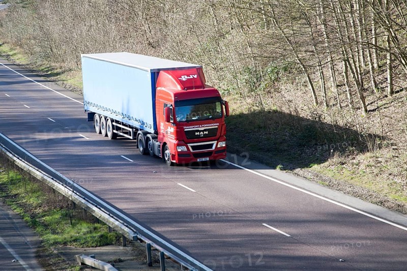 MAN Transport and Forwarding heavy good vehicle on A12 road, Suffolk, England, United Kingdom, Europe