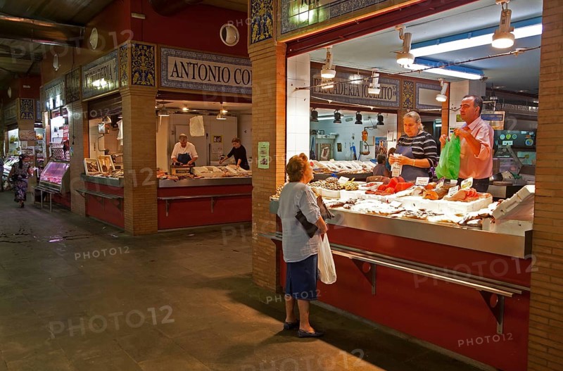 Fishmonger stall in historic market building in Triana, Seville, Spain, Europe