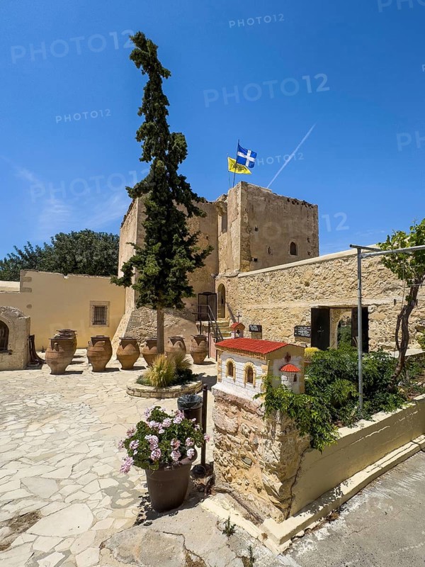 Inner courtyard of Odigitria Monastery In the foreground model of church left in the background large clay vessels right historic monastery defence tower defence tower Xopatera Tower 19th century tower of Xopateras Unesco Site Orthodox Greek Orthodox Monastery Moni Odigitria, Festos, Crete, Greece, Europe