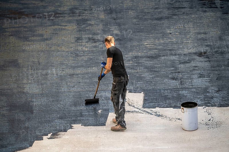 Construction site, application of a bitumen coating to a concrete ceiling, preparation for waterproofing, with bitumen membranes applied thermally, Duisburg, Germany, Europe