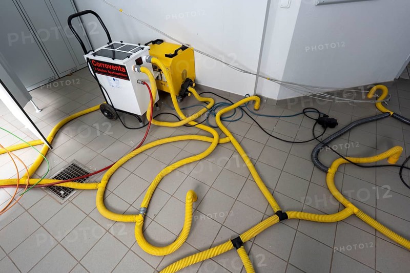 Water damage restoration, dehumidification, after flooding of a building, vacuum drying