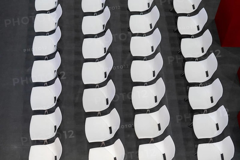Seats with seat shells, at an event, still unused, in row