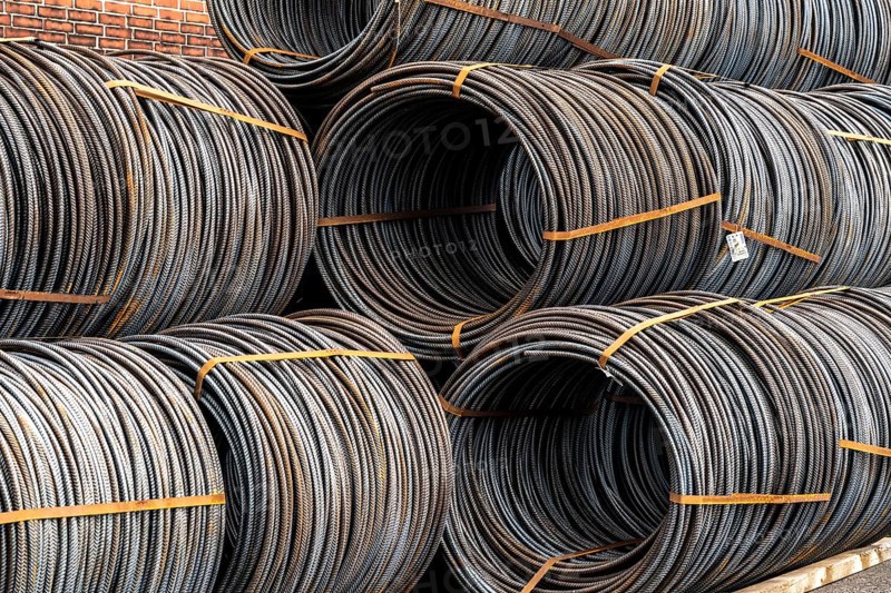 Steel wire, coils, waiting for further processing in the Rhine-Ruhr harbour in Mülheim an der Ruhr, North Rhine-Westphalia, Germany, Europe