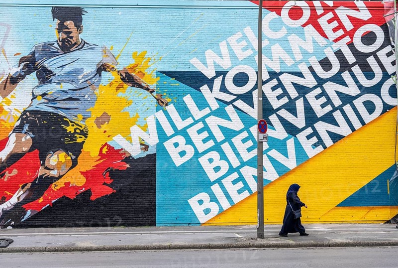 Large-format mural welcoming football fans to EURO 2024 at Dortmund Central Station, North Rhine-Westphalia, Germany, Europe