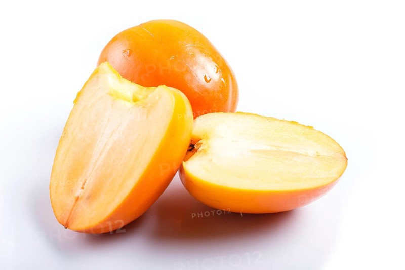 Ripe orange persimmon isolated on white background. closeup