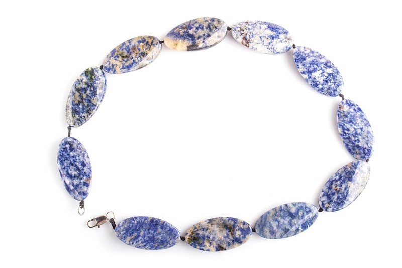 Colored onyx beads isolated on white background. top view, close up