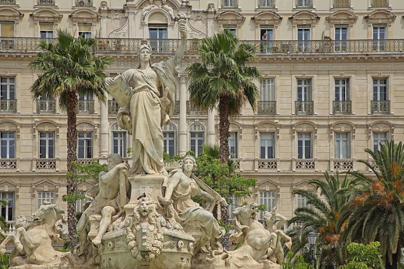 Fontaine de la Fédération built in 1890 with sculptures and decorations and palm trees, Grand Hotel, Statue of Liberty, allegory, Republic, French, arms, high, up, gesture, torch, book, plaque, carry, hold, Federation, Liberty Square, Place de la liberte, Toulon, Var, Provence, France, Europe