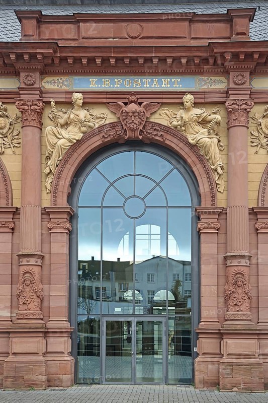 Entrance with stained glass window to the Old Post Office built in 1893 with decorations and figures, Neo-Renaissance, columns, stained glass window, detail, initials, royal, Bavarian, post office, historical, kingdom, Bavaria, Pirmasens, Palatinate Forest, Rhineland-Palatinate, Germany, Europe
