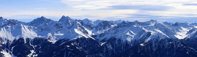 Alpine panorama with snow-covered mountain peaks in winter. Taken in the ski resort of Serfaus Fiss Ladis (Tyrol, Austria)