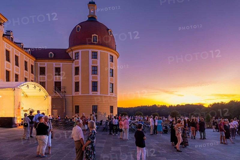 The Moritzburg Festival is an annual chamber music event in Saxony. It was founded in 1993 in Moritzburg by the soloists Kai Vogler, Peter Bruns and Jan Vogler. In Moritzburg, the artists find the ideal setting for the realisation of their musical dreams. The Moritzburg Festival, which has been under the sole artistic direction of cellist Jan Vogler since 2001, has long since established itself internationally as one of the most important festivals for chamber music thanks to its exceptional quality. Here is an evening concert on the north terrace of the baroque palace, Moritzburg Chamber Music Festival, Moritzburg, Saxony, Germany, Europe