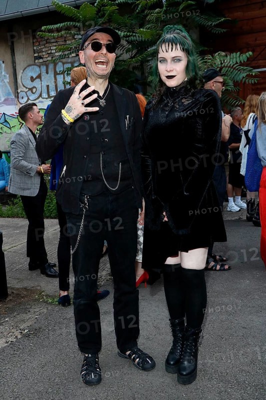Mark Benecke and his woman Ines fisherman at the opening of the Tim Burton exhibition in the Radsetzerei on the RAW site in Berlin on 18 July 2024