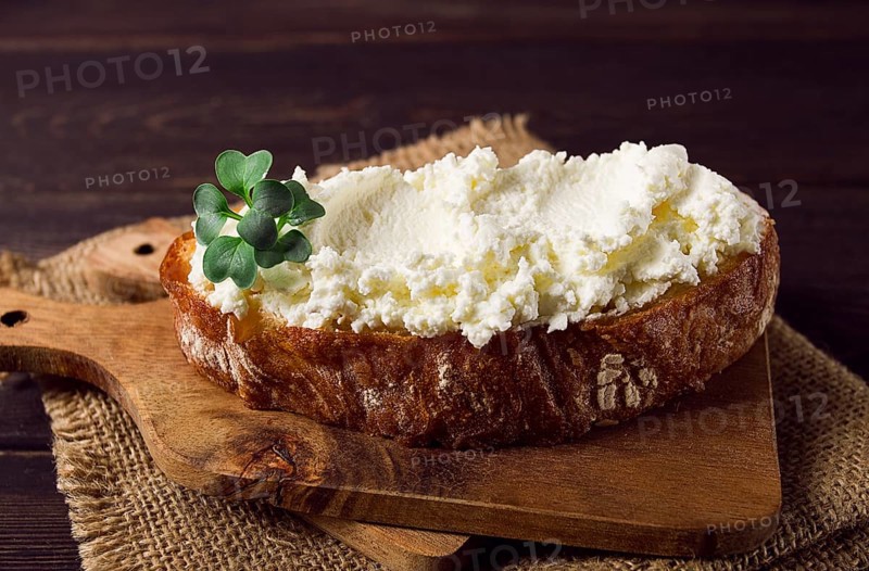 Sandwich, with cream cheese, homemade, on a cutting board, rustic style, no people, selective focus, breakfast