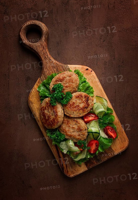 Fried cutlets, turkey, with vegetable salad, top view, no people